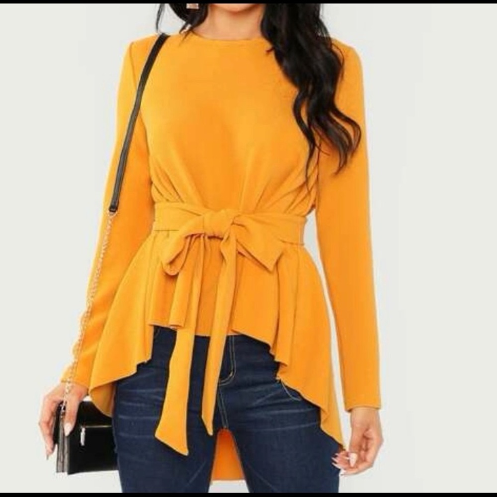 New, never worn, beautiful mustard-colored, asymmetrical top with belt.
